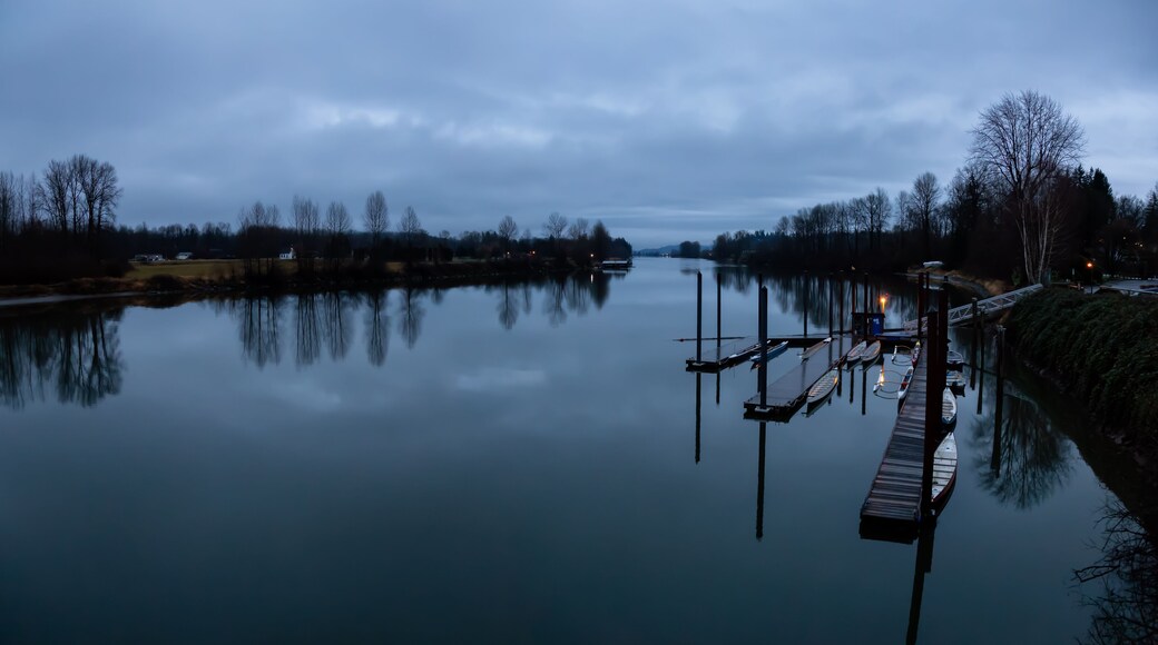 Beautiful view on Fraser River during a cloudy sunset. Taken in Fort Langley, Greater Vancouver, BC, Canada.