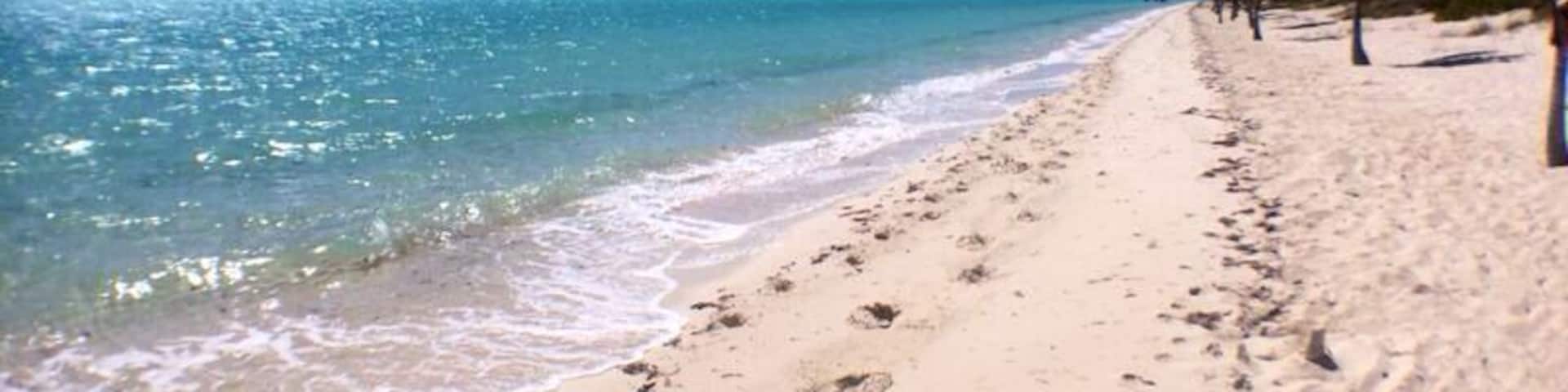 Long Bay Beach is a beautiful, secluded strip of white sand in the south east part of Providenciales. Come here to watch kite surfers showcase their tricks. A heaven spot for pros and beginners who drift to this beach for the best wind, waters, and scenery in the world. #beach