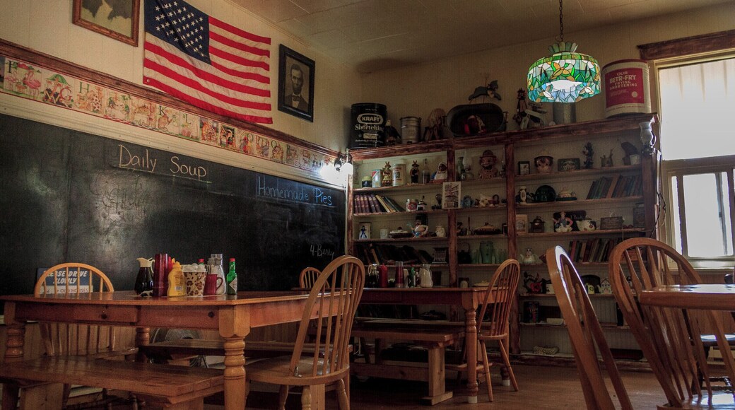 Yesterday's Cafe is located in a one-room brick school house complete with bell tower and bell. The building was constructed with locally made brick from the red butte directly behind the school. Built in 1903 and filled with school children until 1963 when the school consolidated with Lima, 8 miles to the south. The interior and exterior of the school are much the same as it was 80 years ago. The maps, chalk boards, hardwood floors and school books still fill the building. Our menu features homemade pies, soups, roll and hamburger buns, daily lunch and dinner specials. Come step back in time and enjoy a home cooked meal with us.
Saloon and casino with beer and wine available. The Saloon is filled with antiques and original iron work. Meals from the cafe can be served in the saloon. We also have a gift shop with handmade quilts and many one of a kind items. Nearly all of which are made in Montana.
Directions: Yesterdays Cafe is located at Exit 23 off Interstate I-15 in southwest Montana in Dell Montana. 40 miles south of Dillon, Montana.