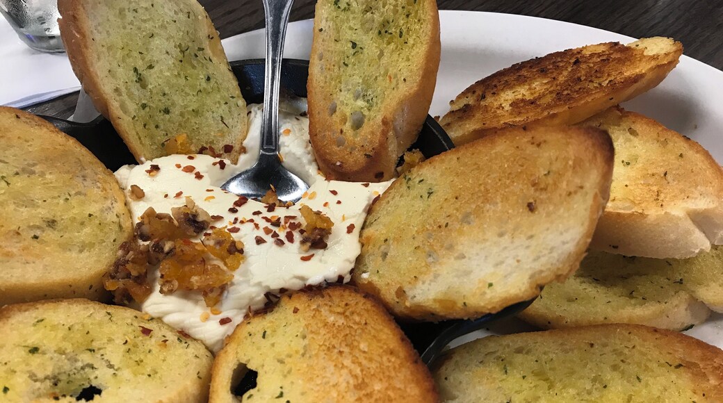 Baked goat cheese with dried apricots, walnuts, and garlic bread #Yum