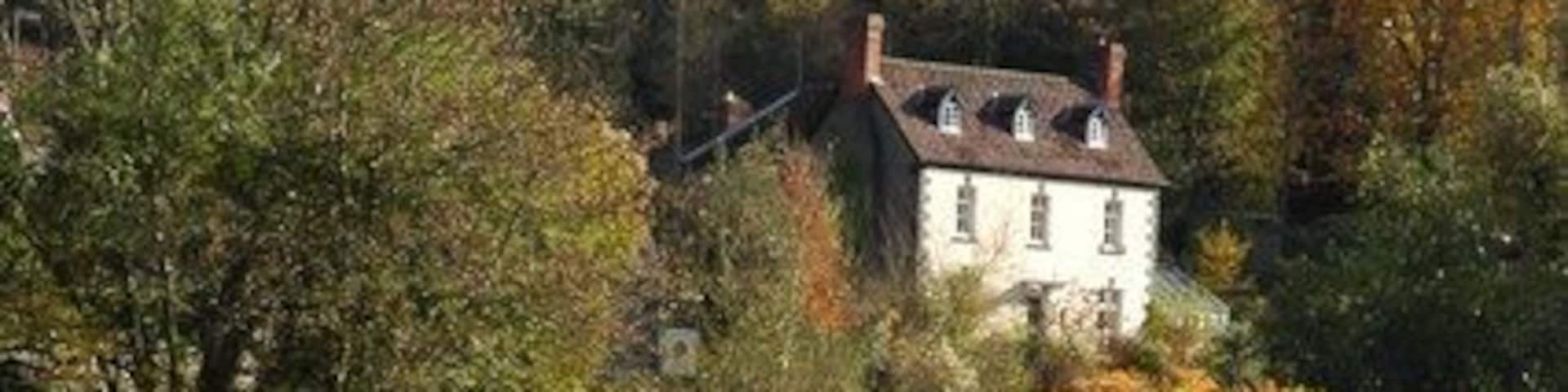 House in the Wye Valley House in the Wye valley reflected in the river.