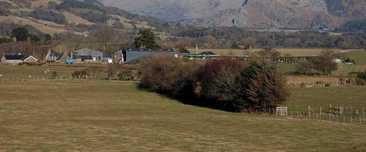 View up Dyffryn Dysynni Looking over Waenfach farm to the valley, with the well-known Birds' Rock / Craig yr Aderyn clearly visible on the right. Cadair Idris and Mynydd Pencoed form the left skyline.