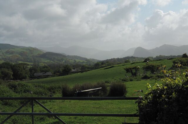 Somewhat unconventional bathing arrangements Pasture south of Llanegryn. Bird's Rock and Cadair Idris can be seen in the haze.