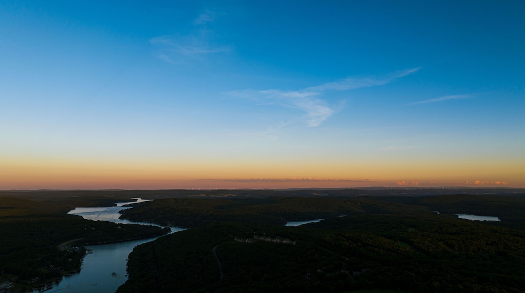Beautiful landscape with the Deep Creek Lake under a sunset sky