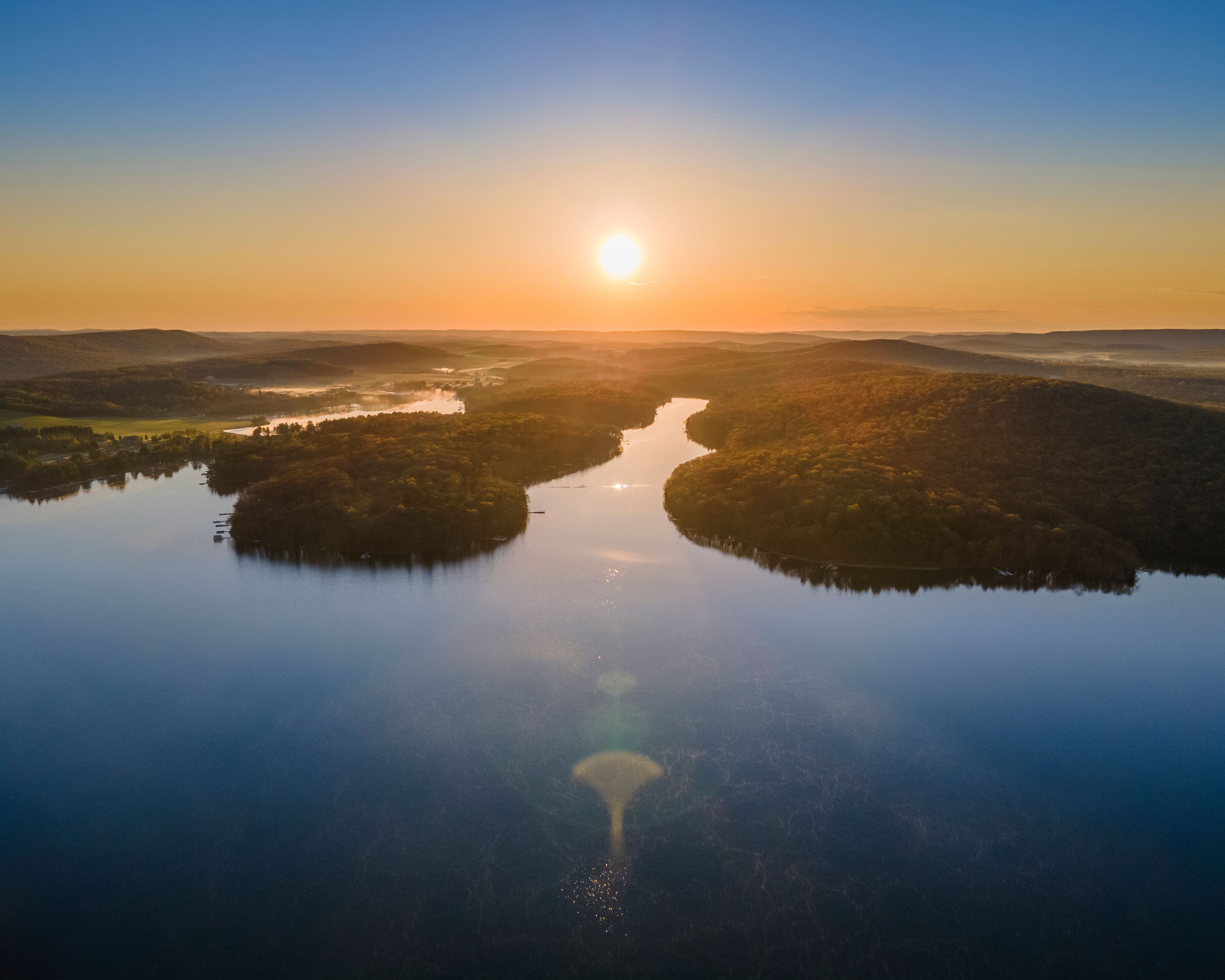 Aerial view of the sunrise over Deep Creek Lake in McHenry Maryland, United States.