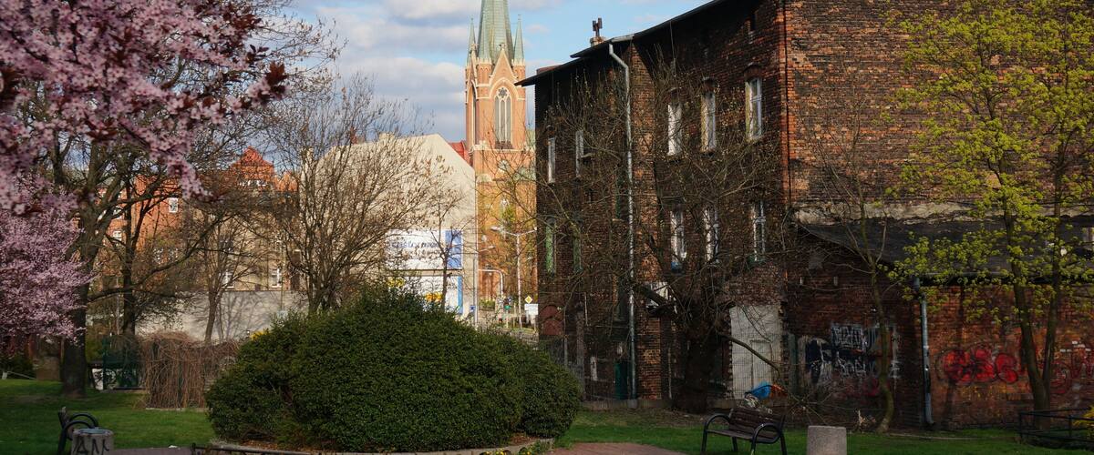 Corner of the city. Saint Stephen's Church in background, spring in Bogucice neighbourhood. Katowice, Poland.