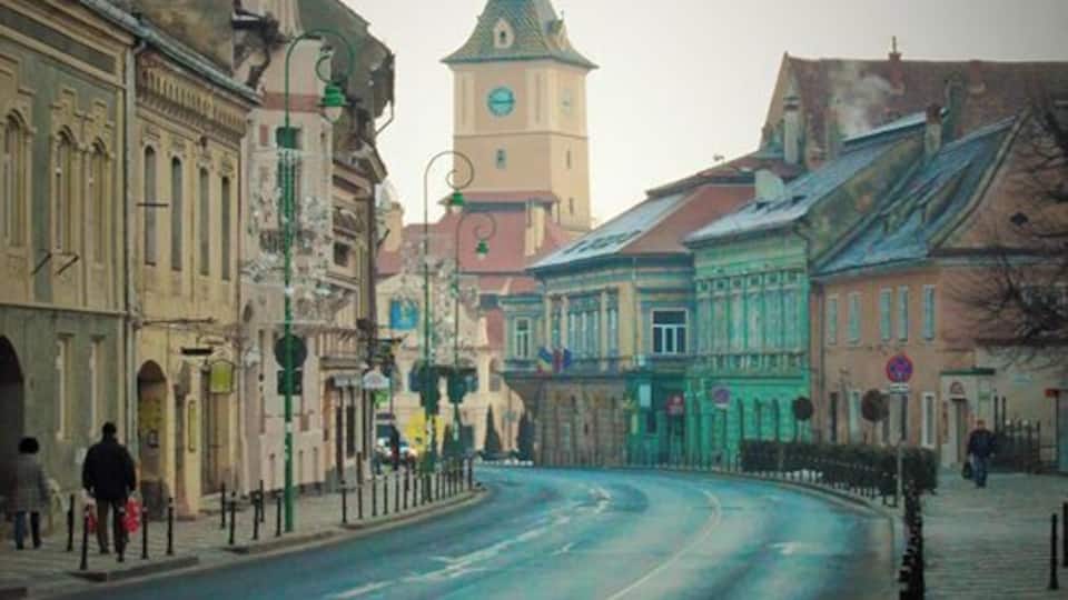 Get up early morning and watch the sun starting to reach downtown from up the mountain