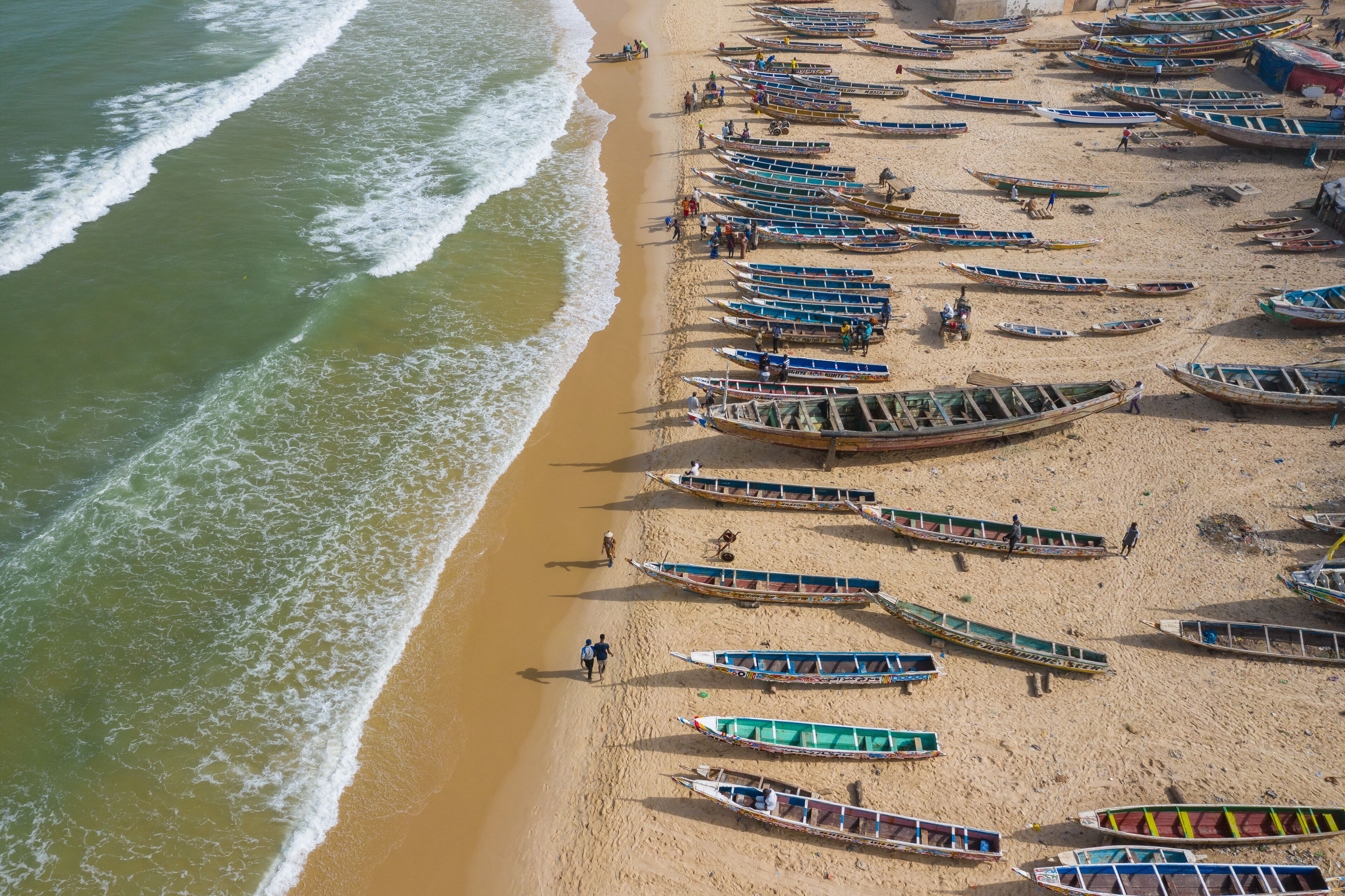 Aerial view of fishing village, pirogues fishing boats in Kayar, Senegal.  Photo made by drone from above. Africa Landscapes.