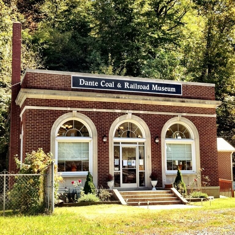 A brick building with a sign reading "Dante Coal & Railroad Museum."