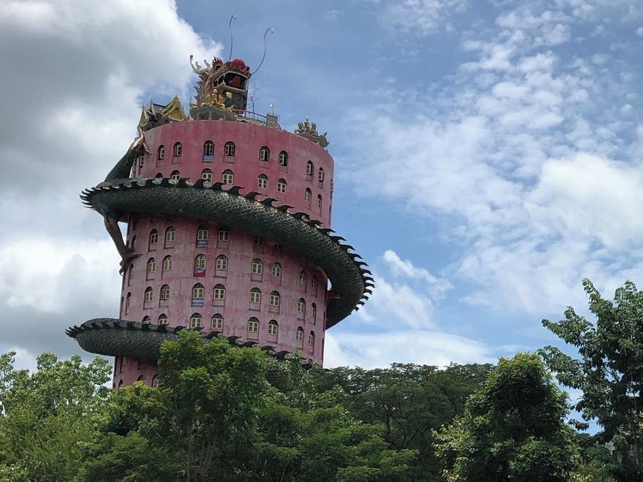To go to the top of this tower, walk inside the dragon's body.