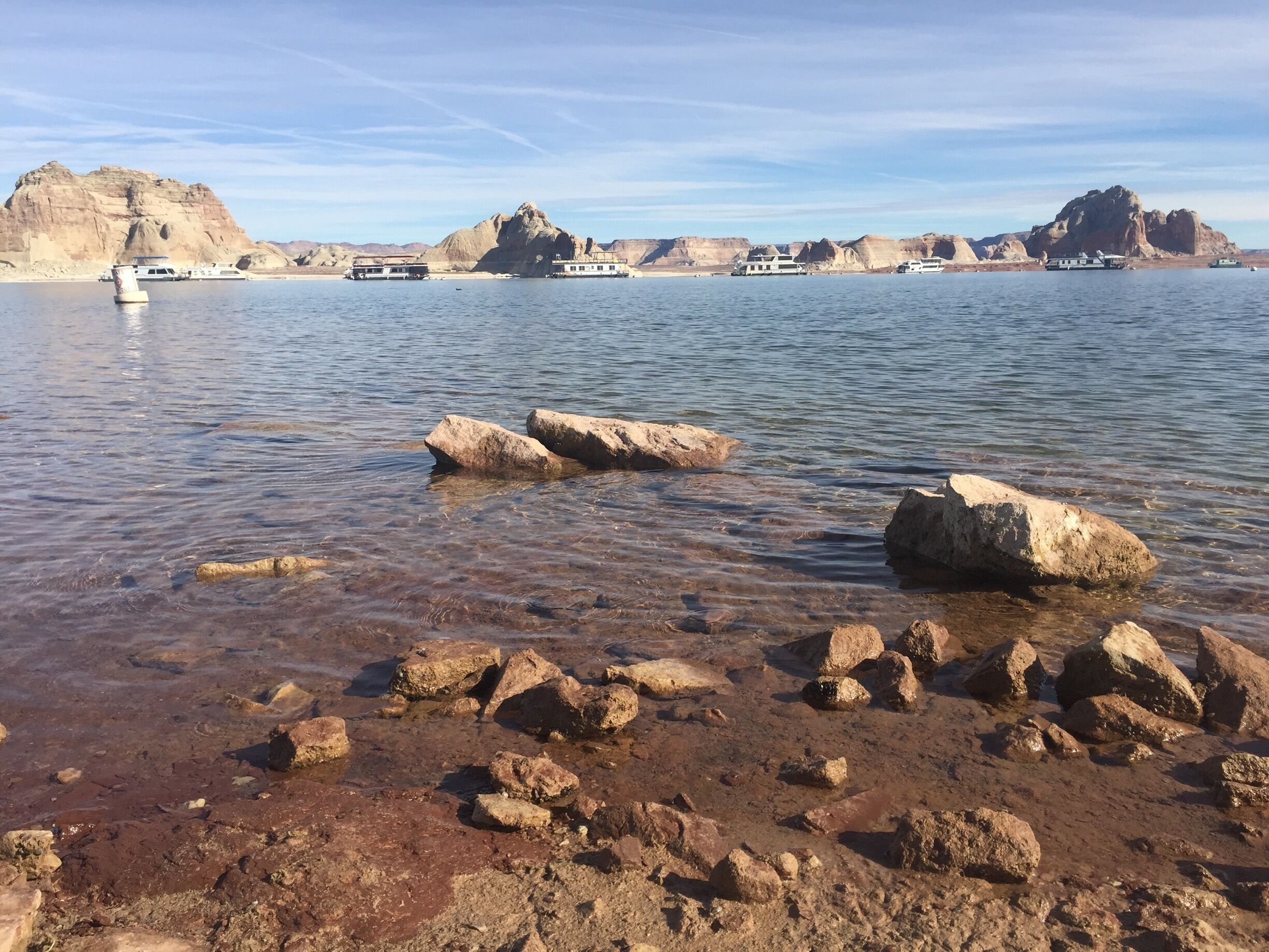 Serene lake surrounded by cascading mountains and unequivocal silence. 