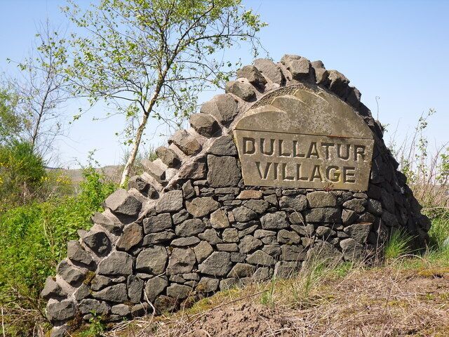 Dullatur Village This large sign can be found at the entrance to Dullatur Village from the approach from Cumbernauld.