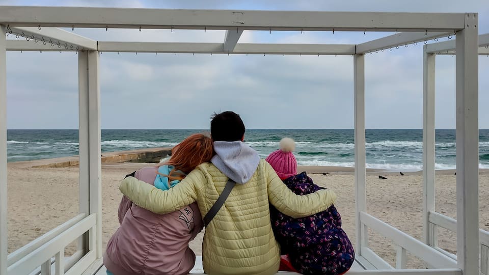 A beach shelter with a view of the ocean.
