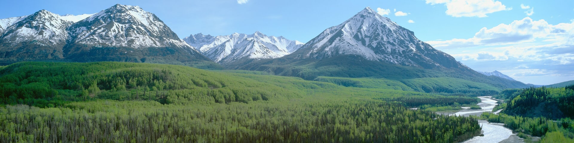 Snowy mountains, green forests and river in Matanuska Valley, Alaska
