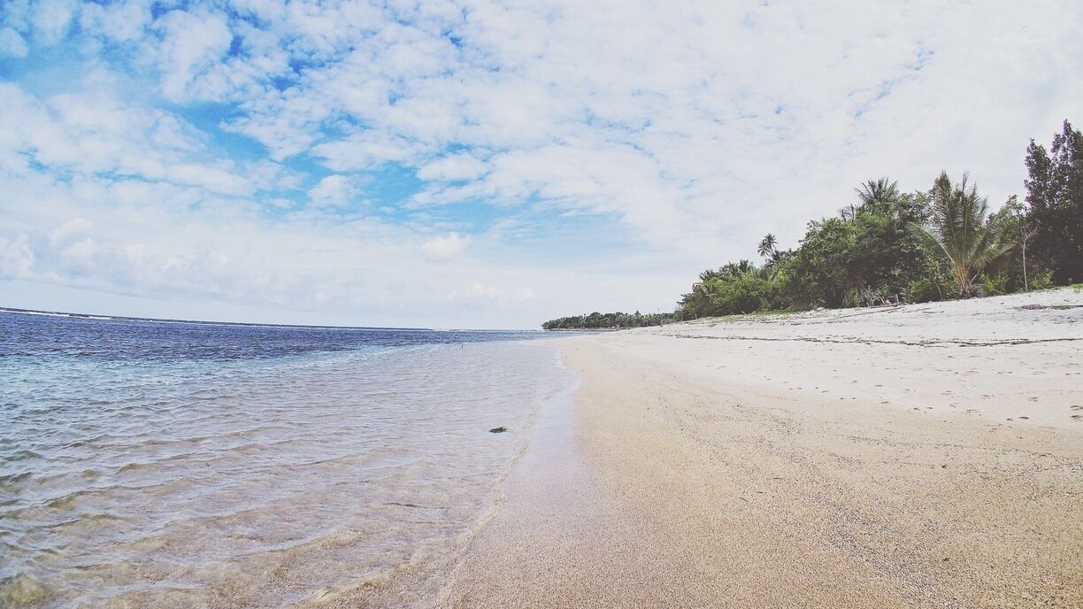 • Kora Kora Beach •

This white sand beach is a hidden paradise is North Sulawesi.

Long beautiful white sand coastline, it's a very quiet beach and you can hear the calming waving sounds along with the insects singing!

There are some local cottages around here.

Not so many things that you can do here except relaxing and enjoying the beach.
You might surf but it's not popular yet here, because the sea wave isn't that big.

It's far from everywhere but during the road trip to this place you'd see beautiful sceneries! I suggest you to ask locals the hot spot on the one of the hills, so you can see the breathtaking view of this unending white beach.