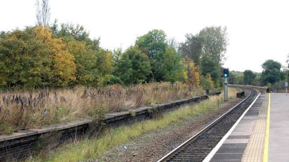 Olton railway station photo-survey (12) Looking in the down (northbound) direction at Olton station. Note the overgrown disused platform to the left of the photo (see below). Olton station is on the ex-GWR (Great western Railway) London to Birmingham line. It serves the suburbs of Olton and Ulverley Green about six miles east-southeast of Birmingham city centre. The line was originally built with double track and Olton station had two facing platforms, one either side of the two through lines. However, in the early 1930s the GWR quadrupled the track in the Birmingham area to cope with greatly increased suburban traffic. After quadrupling, Olton station had two island platforms, one serving the two down lines, the other serving the two up lines. Today, the route is reduced to two tracks again and one of Olton's 1930s island platforms (the one on the east side of the site) serves the up and down lines. The other island platform is no longer accessible and is very overgrown. Olton station is operated by London Midland as part of Network West Midlands and is a designated rail/bus interchange point. The majority of train services are operated by London midland but some Chiltern Railways trains call at Olton.
