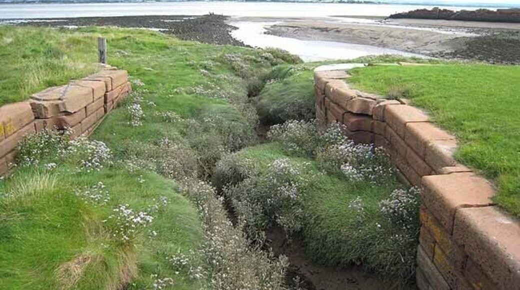 Old sea lock on the Carlisle Canal Port Carlisle was constructed in the 19th century to provide a deep-water port for Carlisle. A canal was constructed from here to Carlisle, completed in 1823, but was closed after only 30 years. The port did not flourish and is now just a ruin. The Scottish shore can be seen on the far side of the Solway Firth.