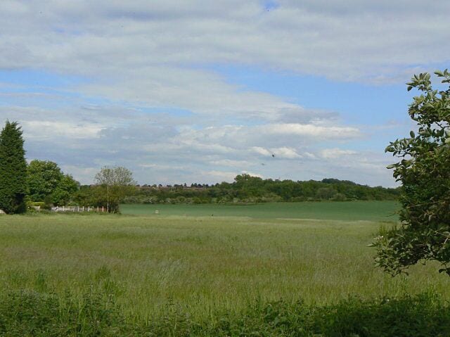 Fields near Silverdale (1) This view is looking east pretty well along the line of the proposed tram route to Clifton. It will pass close to the protruding fence at the left, then up to the distant hedge line. This marks the former Great central Railway line, onto which the tram will turn left and follow almost as far as Wilford Bridge.
