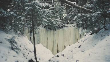 High angle view of frozen waterfall in forest