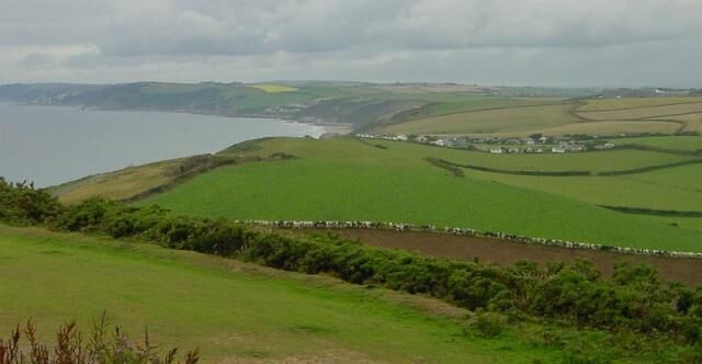 North west along the coast towards Portwrinkle & Downderry. From Whitesands Battery. The odd black and white line across the lower half of the picture are cattle eating their way across a kale field.