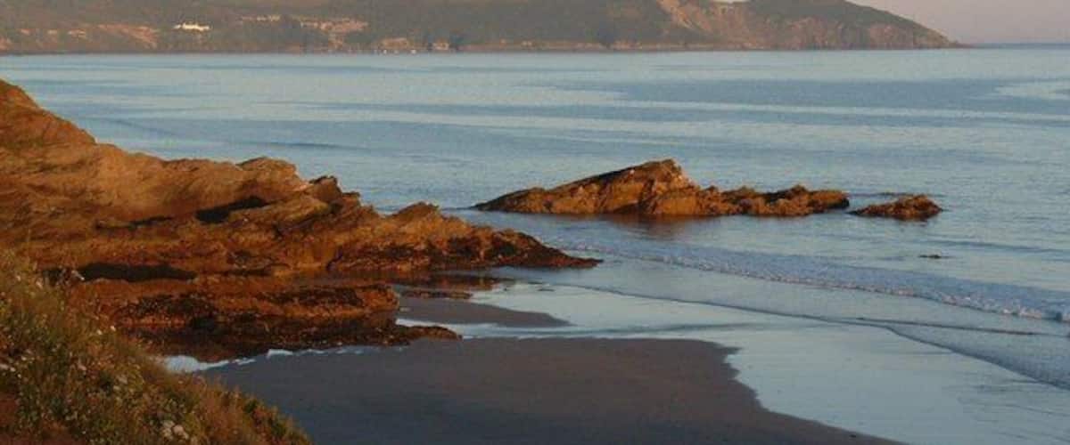 Rame Head from Freathy beach Glowing in evening sunlight