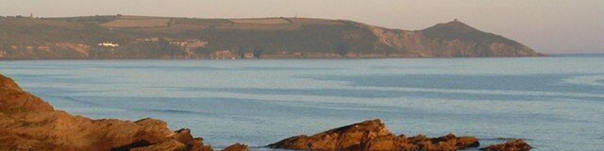 Rame Head from Freathy beach Glowing in evening sunlight