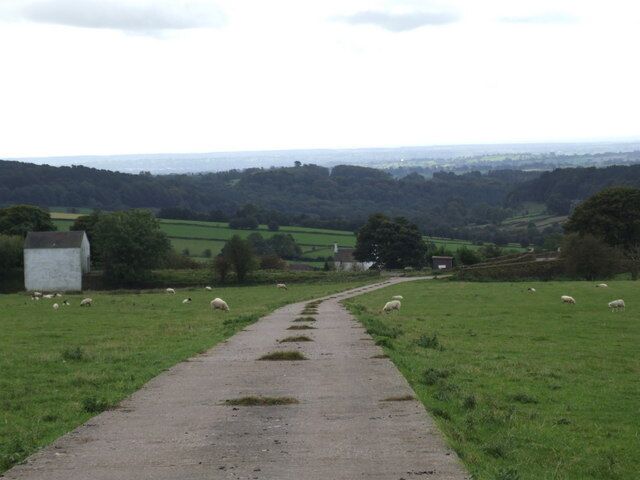 Looking down to Trubshaw's Caldon Tramway Taken from just below the A52, this shows the 1847 Caldon Tramway crossing an embankment adjacent to the white building. An overbridge can be seen at the right hand end of the bank, where the farm road wriggles to cross it. Part of the tramway formation has been used by water services.