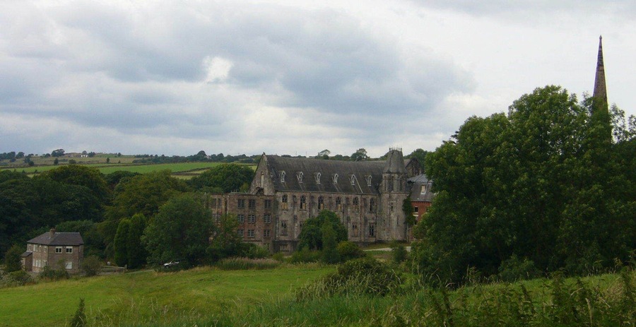 Part of the former St Wilfrid's College, Cotton, a Roman Catholic former boarding school in Staffordshire. On the right is the spire of St Wilfrid's chapel.