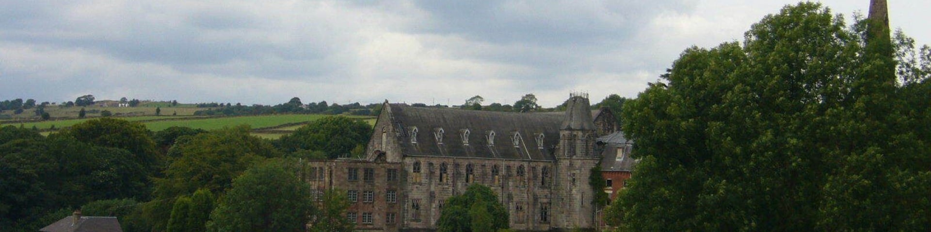 Part of the former St Wilfrid's College, Cotton, a Roman Catholic former boarding school in Staffordshire. On the right is the spire of St Wilfrid's chapel.