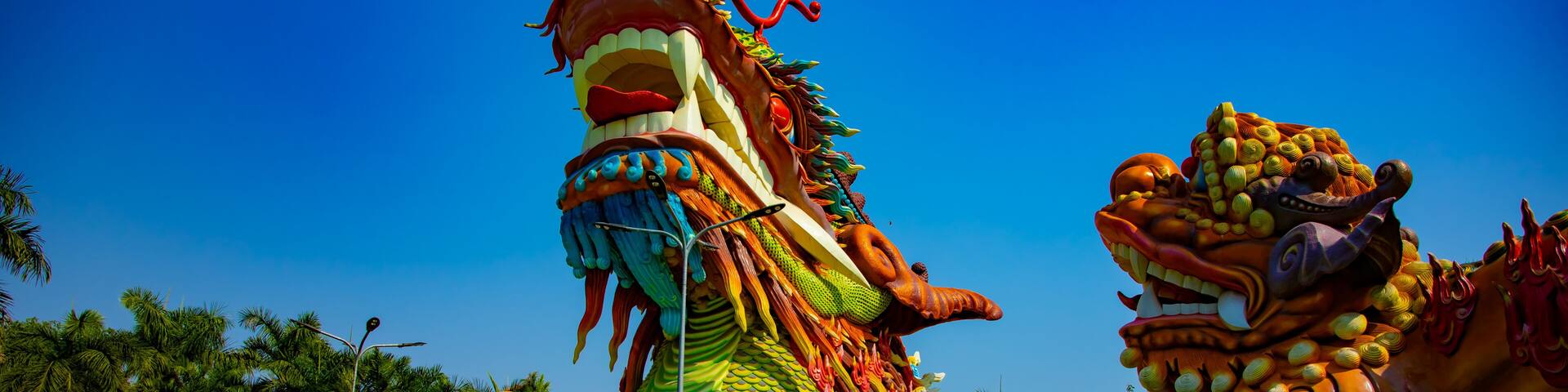 A dragon boat with intricate designs and a dragon head at the front.