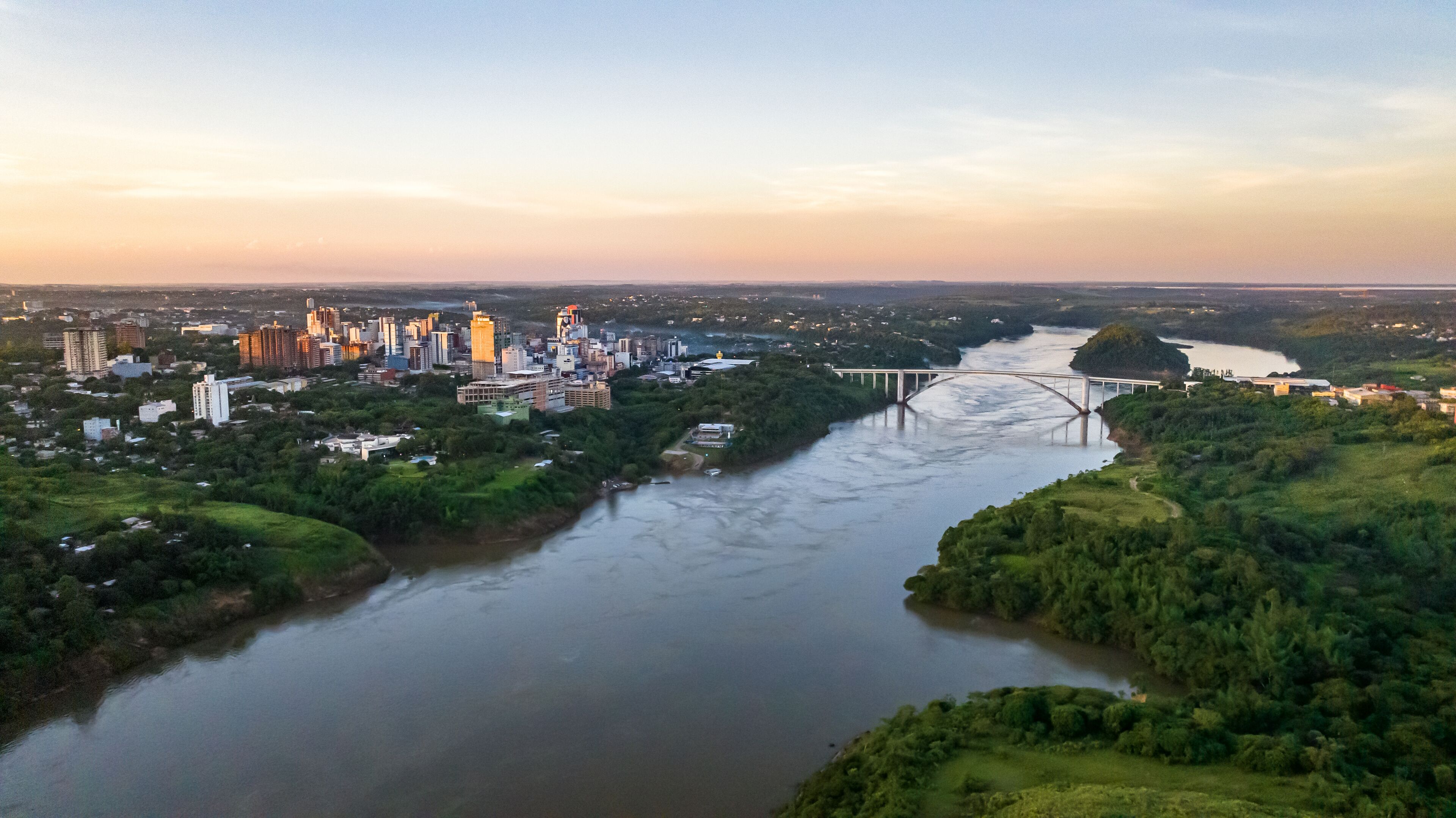 Border between Brazil and Paraguay and connects Foz do Iguaçu to Ciudad del Este. Ponte da Amizade in Foz do Iguaçu. Aerial view of the Friendship Bridge with Paraná river..