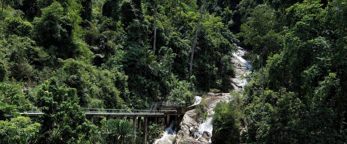 Aerial view of Sungai Tebing Tinggi stream located in Selama Perak, Malaysia - Calm view of Tebing Tinggi Waterfall in Batu Kurau, Perak, Malaysia