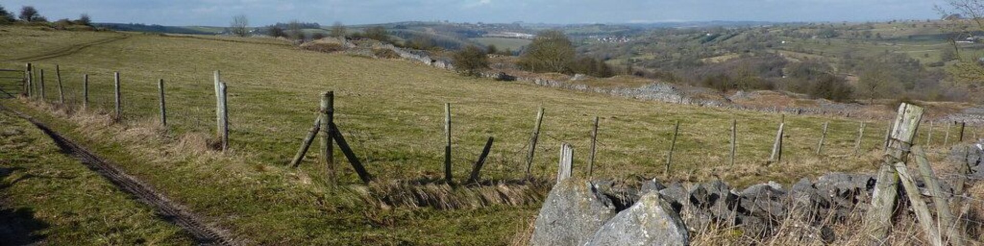 West by north west From a track from Middleton by Wirksworth; Ible and Grange Mill Quarry in the distance, on the other side of the Via Gellia (A5012)