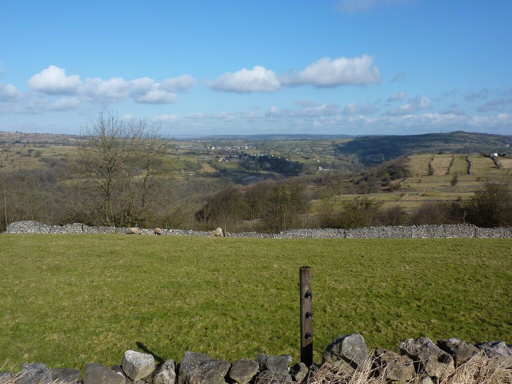 View from a track west of Middleton by Wirksworth Looking north; the village in the distance is Bonsall. Strip fields can be seen in middle distance, right. Middleton was a farming community, long before the arrival of the quarries.Just to the left of the strip fields, the chimney of Arkwright's Masson Mill can be seen ( at SK 294 573 )