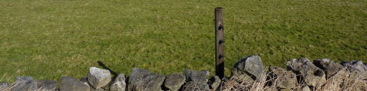 View from a track west of Middleton by Wirksworth Looking north; the village in the distance is Bonsall. Strip fields can be seen in middle distance, right. Middleton was a farming community, long before the arrival of the quarries.Just to the left of the strip fields, the chimney of Arkwright's Masson Mill can be seen ( at SK 294 573 )