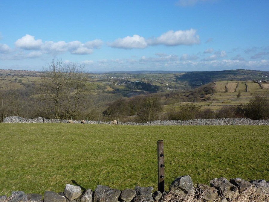 View from a track west of Middleton by Wirksworth Looking north; the village in the distance is Bonsall. Strip fields can be seen in middle distance, right. Middleton was a farming community, long before the arrival of the quarries.Just to the left of the strip fields, the chimney of Arkwright's Masson Mill can be seen ( at SK 294 573 )