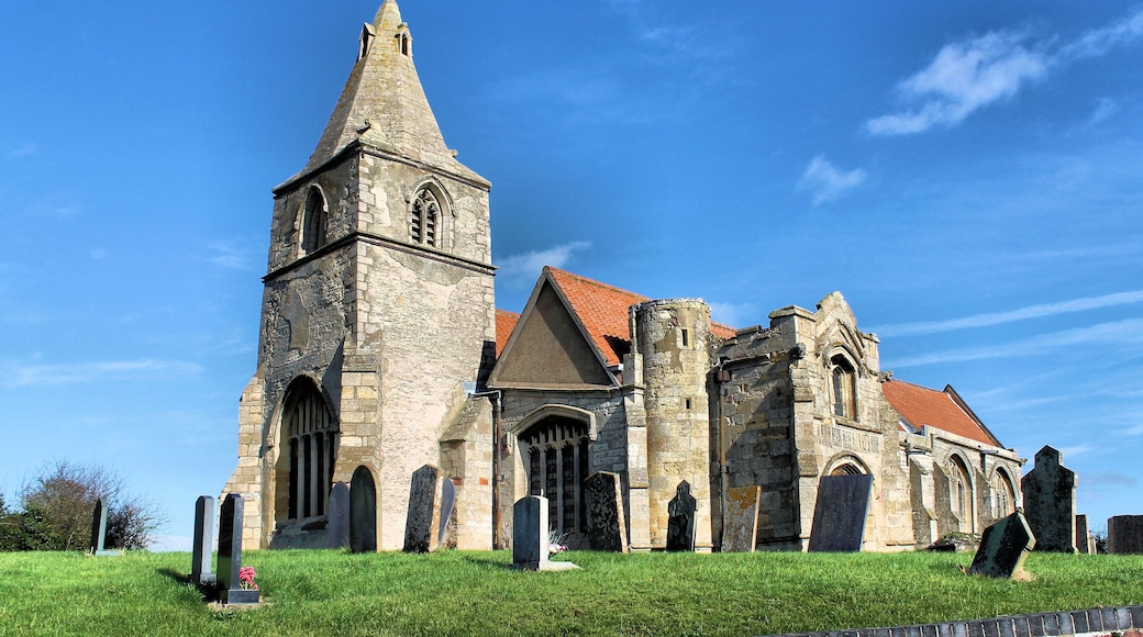Early English and Decorated with Perpendicular tower arch. Re-used C12 and C13 material from original parish church which was demolished and rebuilt in 1862 by Edward Browning. Contains a monument to John Barton (d.1491) a rich wool merchant who founded the church. He built the tomb in his lifetime featuring him and his wife Isabella, with a cadaver "memento mori" below. 'Miseremeni mei saltem vos amici mei quia manus domini tetigit me' ('Pity me you at least my friends for the hand of the Lord has touched me'). The room over the porch is at the centre of the local legend of โNan Scottโs Chamberโ. It is said that Nan Scott left her house in Holme during the great plague of 1666 to live in this room away from infection for several weeks. When forced to visit her house for supplies she found the parish deserted except for herself and one other, and was so horrified she returned to the chamber and ended her days there. Pic by Jenny