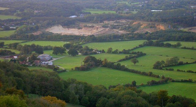 Rock Common Quarry Viewed from Chanctonbury Ring to give an idea of the scale of the quarry. The farm to the left is Locks Farm.