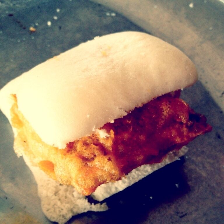 A sandwich with a white bun and a filling that appears to be a type of meat.