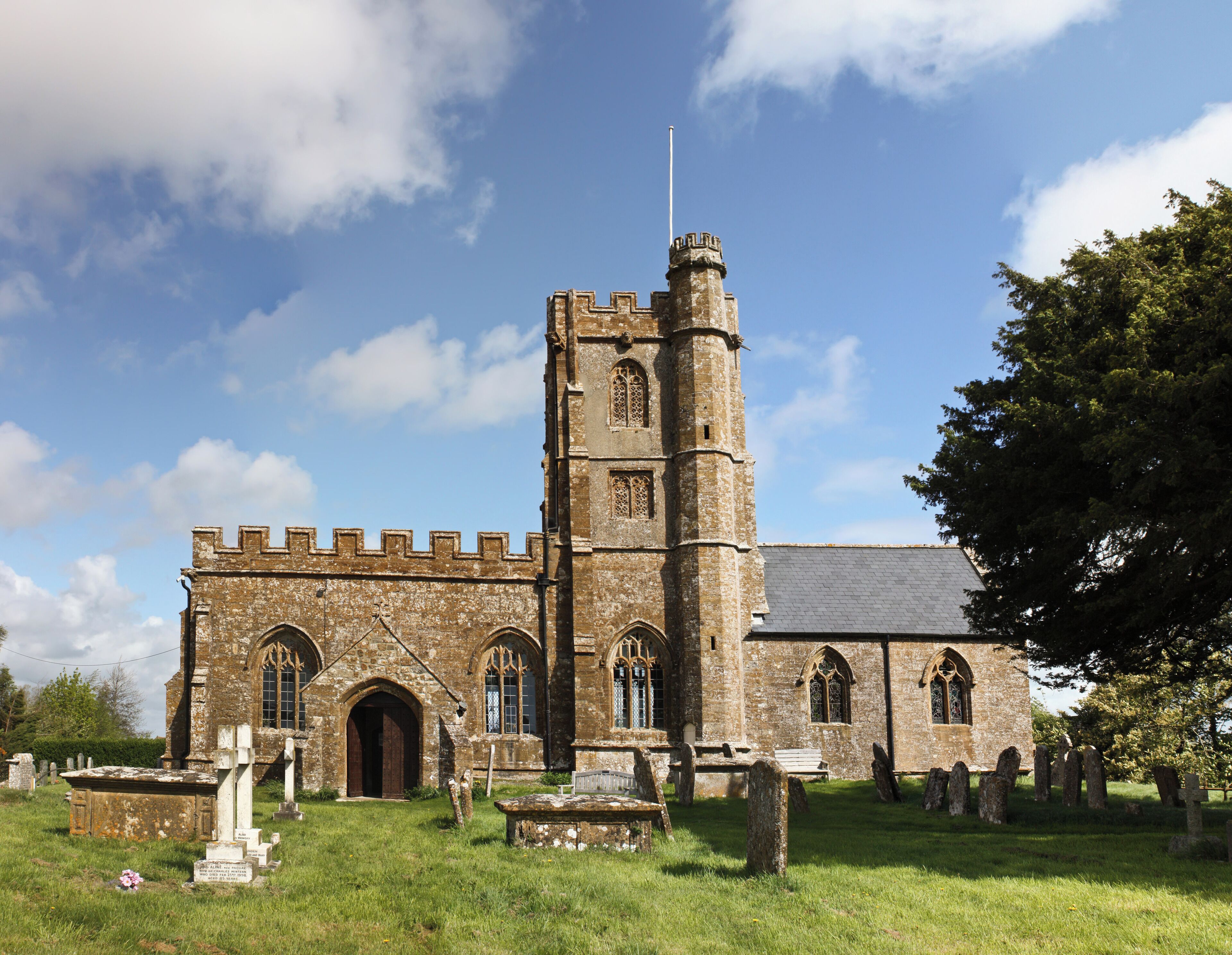A historic church with a tall tower and arched windows.