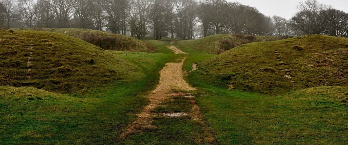 Badbury Rings is an Iron Age hill fort in east Dorset, England. It was in the territory of the Durotriges. In the Roman era a temple was located immediately west of the fort, and there was a Romano-British town known as Vindocladia a short distance to the south-west