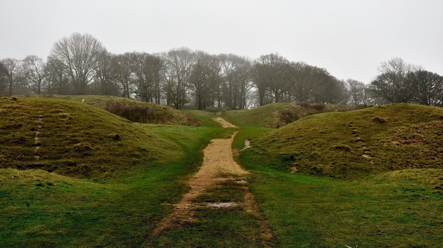 Badbury Rings is an Iron Age hill fort in east Dorset, England. It was in the territory of the Durotriges. In the Roman era a temple was located immediately west of the fort, and there was a Romano-British town known as Vindocladia a short distance to the south-west