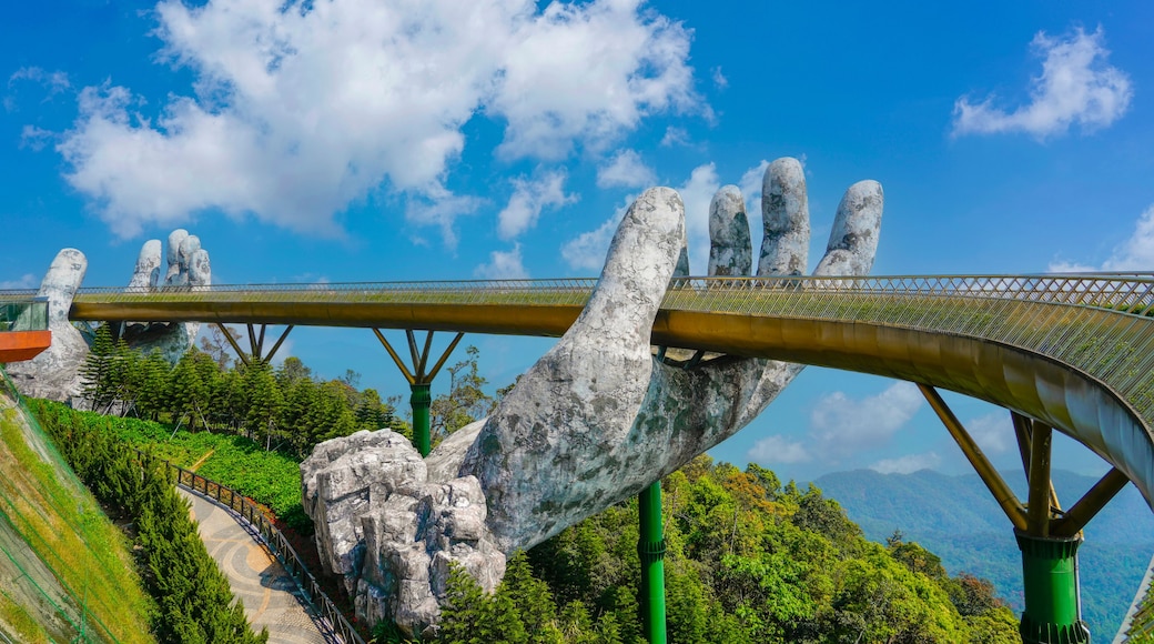 Famous tourist attraction among the tropical jungle in the forests - empty golden bridge