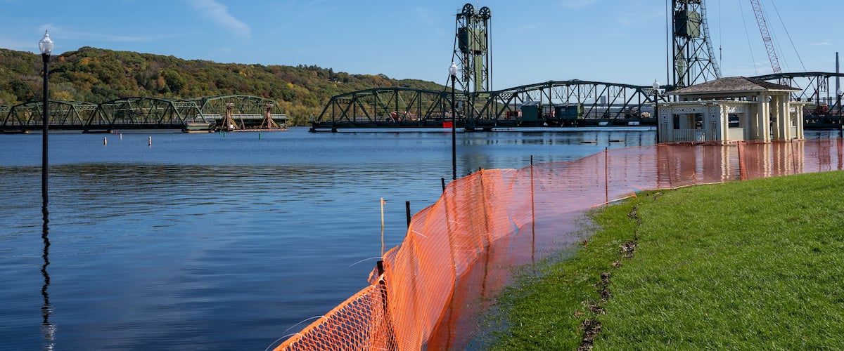 Stillwater Minnesota Cityscape view of the flooded Lowell Park in autumn. Historic Stillwater Lift Bridge under construction, over the St Croix River