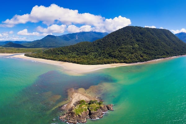 Aerial image of Thornton Beach located in the Cape Tribulation section of Daintree National Park, located in the tropical far north of Queensland, Australia.