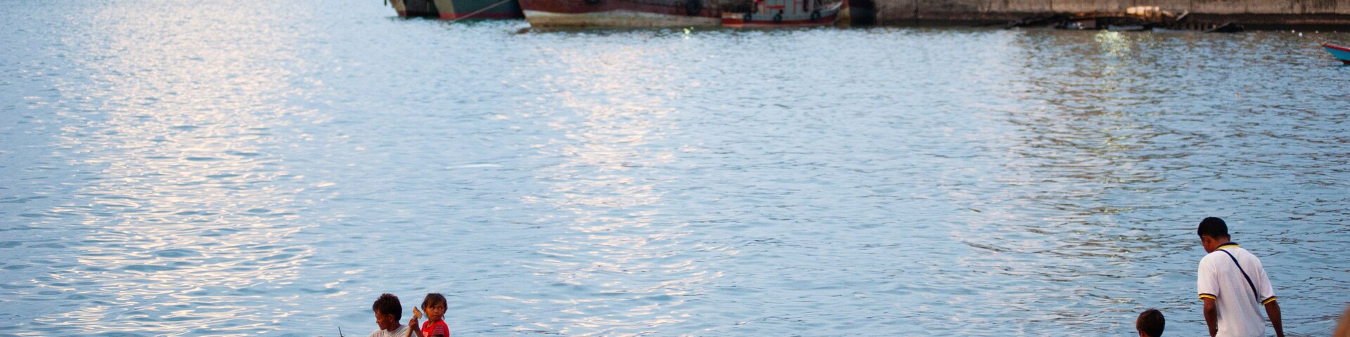 Kota Kinabalu Waterfront which includes boating and a bay or harbor as well as children