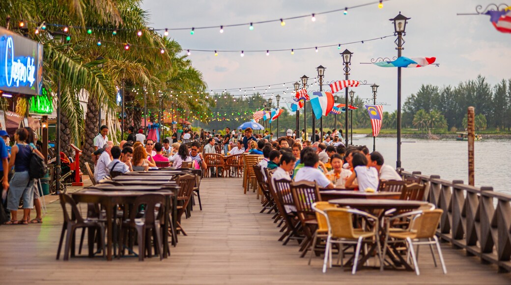Kota Kinabalu Waterfront featuring outdoor eating as well as a large group of people