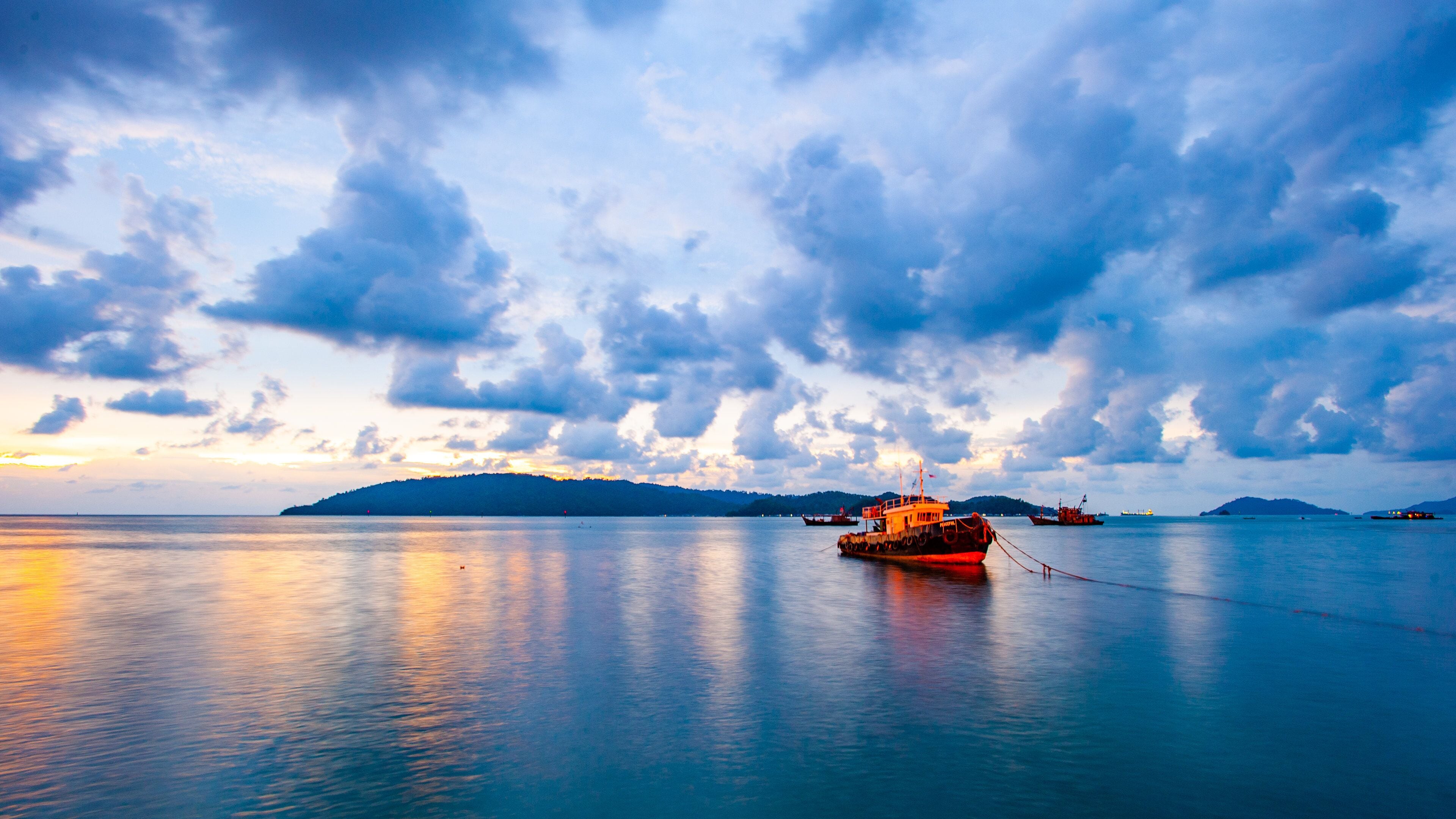 Kota Kinabalu Esplanade which includes a sunset and general coastal views