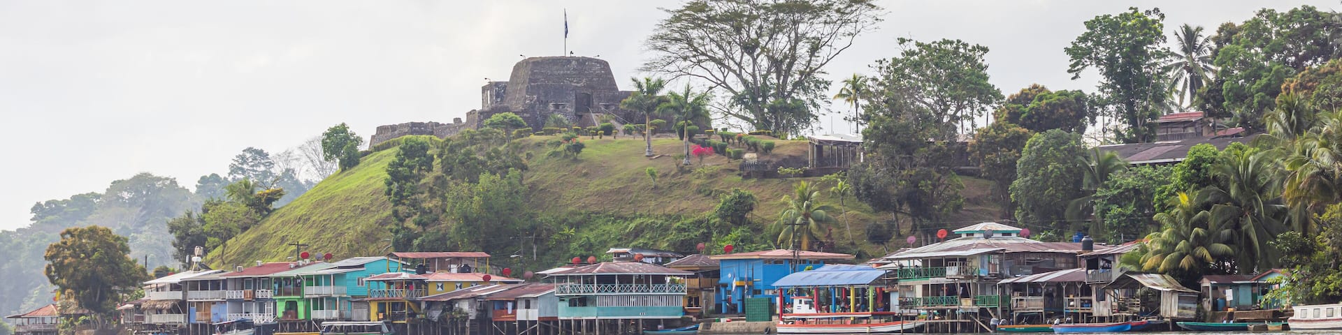 Scenic view of colorful houses and fortress of El Castillo village along the San Juan river in Nicaragua