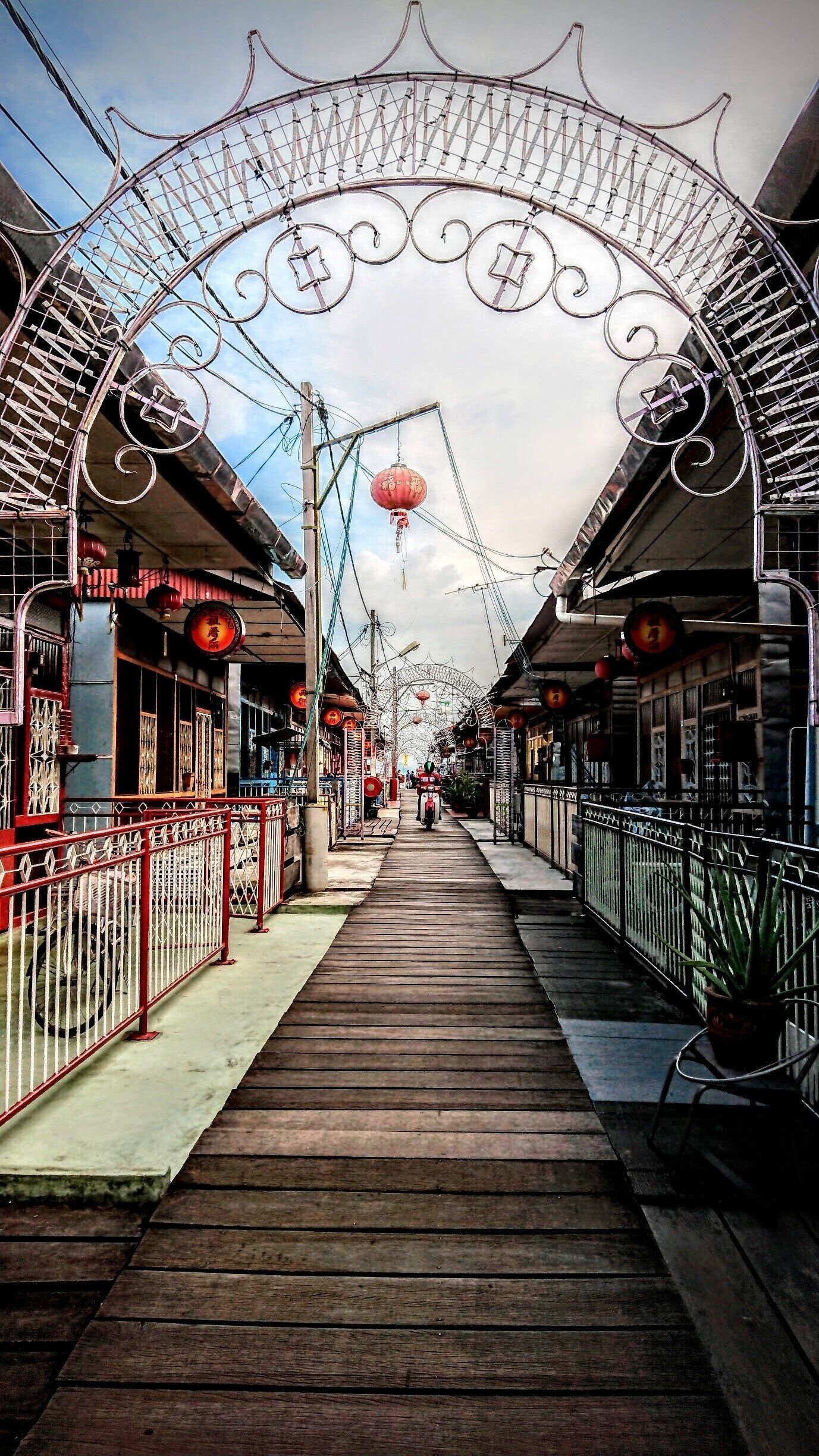 Shot at the Lee Jetty in George Town, Penang, Malaysia. The clan jetties represent a coastal fishing village that are still being run by a number families of various ethnic Chinese clans namely Lee, Tan and Chew. The jetties are easily accessible if you took the Ferry from mainland Penang and it is of walking distance.